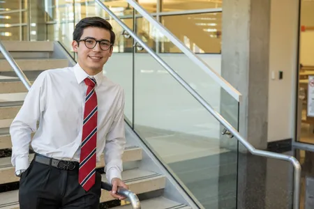 dallas college student wearing red tie with white collared shirt