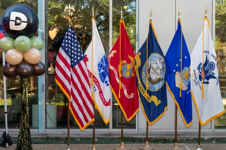 dallas college balloon alongside all military flags