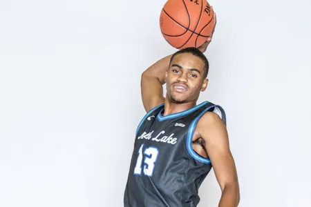 A North Lake Basketball player jumps to dunk the ball