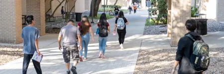 people walking on campus