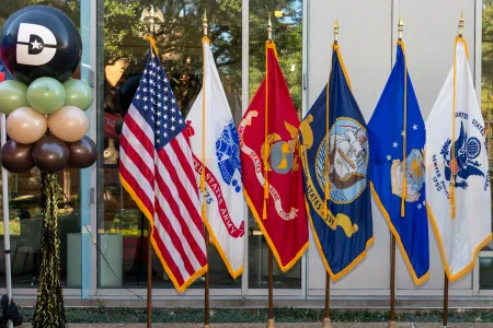 dallas college balloon alongside all military flags
