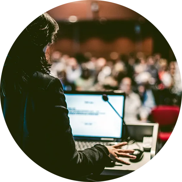 Woman giving a speach or presentation in an auditorium