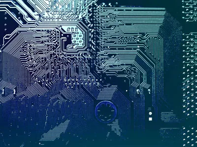 Computer circuit board with electronic pathways and microchip connections.