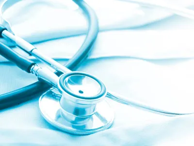 Stethoscope resting on a medical coat.