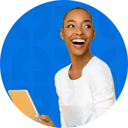 A student on her laptop on a patterned background