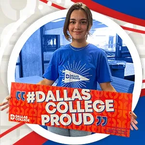 Student holding a '#DALLAS COLLEGE PROUD' sign, wearing a Dallas College t-shirt.