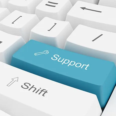 Close-up of a keyboard with a blue key labeled 