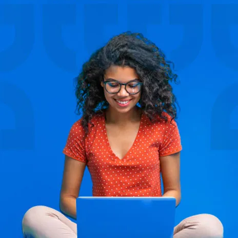 Girl on a laptop with a blue patterned background