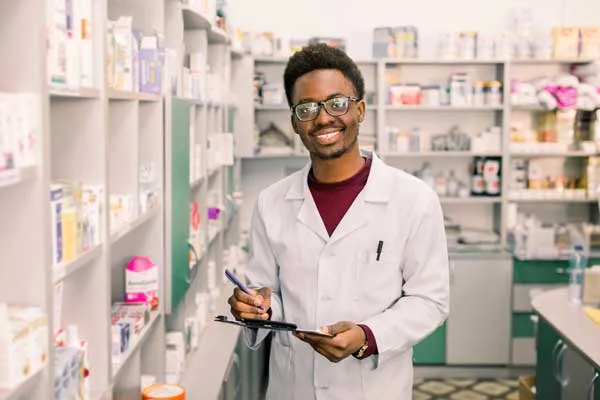 male pharmacy tech smiling