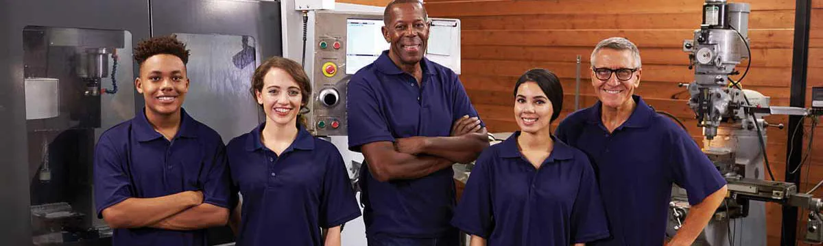 group of five people wearing nay polos and smiling