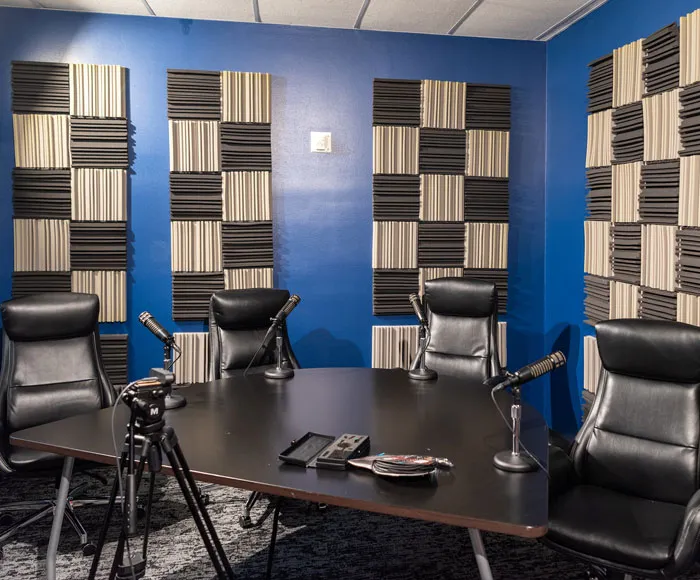 The Venture Club podcast studio with microphones around a table