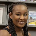A closeup of a smiling student in a library