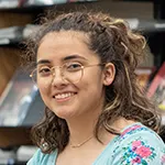 Closeup of a smiling student in the library