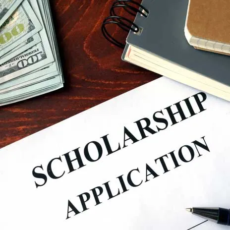 a college scholarship application with a pen