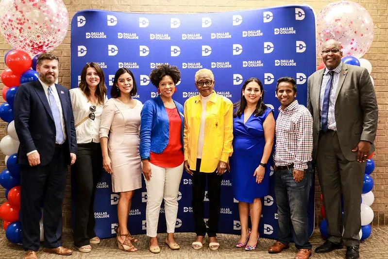 Employees and board members pose for a photo at Uncle Joe's cookout