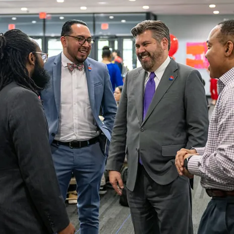 Employees talk to Chancellor Lonon at a Coffee With Justin event