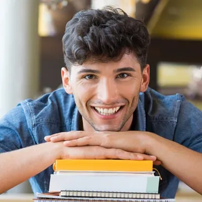 Photo of Hispanic Student on Books