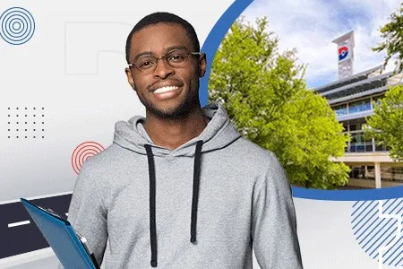 a young man wearing a hoodie and a Dallas College building