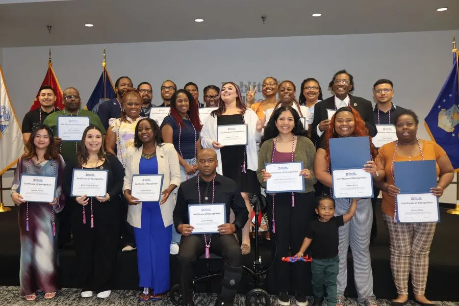 MCS students take a group photo and hold their certificates