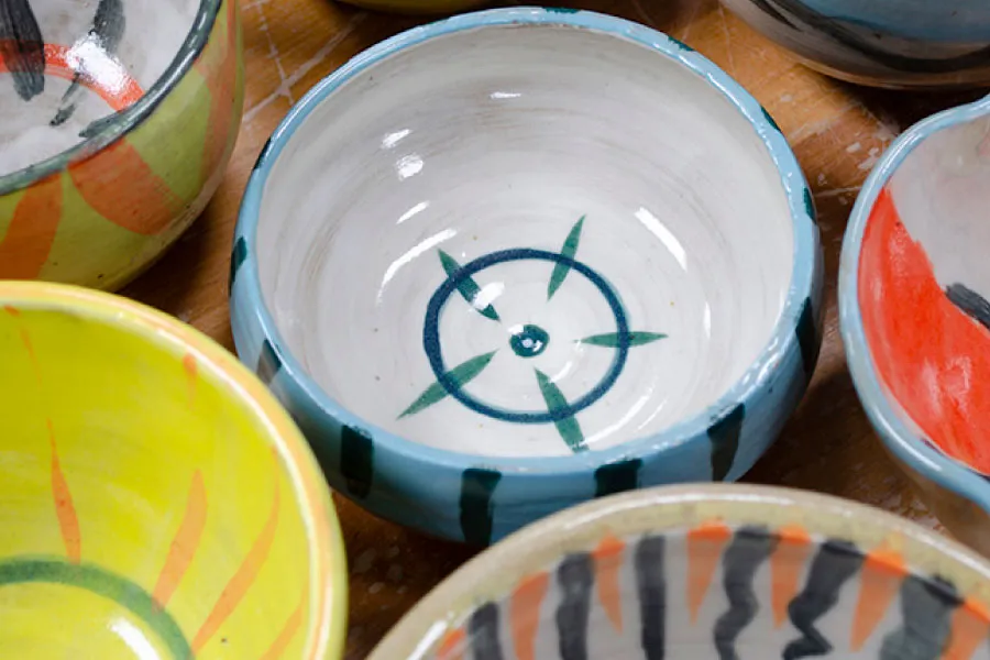 close-up of several colorfully painted ceramic bowls