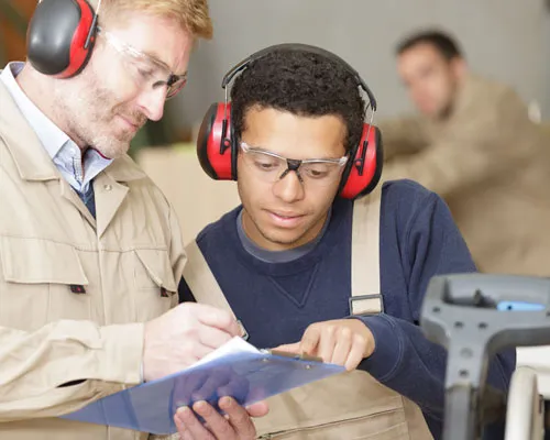 Surveyors looking over a clipboard