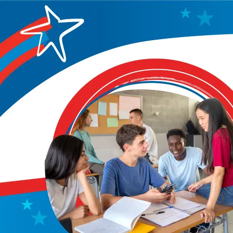 A group of students do schoolwork in a classroom setting.