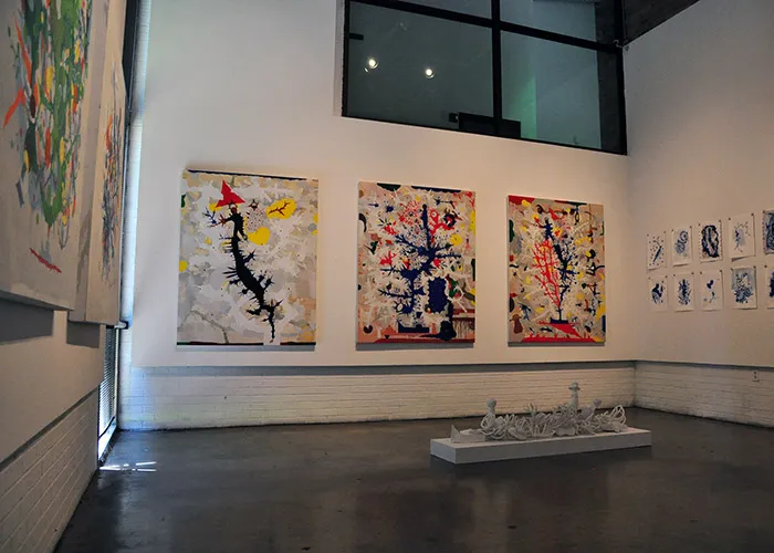 Paintings hang at the Studio Gallery