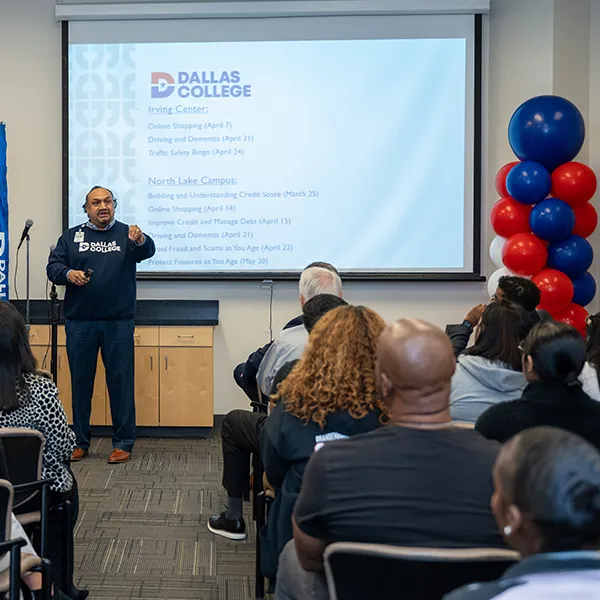 A class full of students listens as an instructor provides instruction