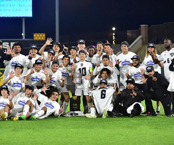 The Richland Mens Soccer team celebrates their championship with a team photo