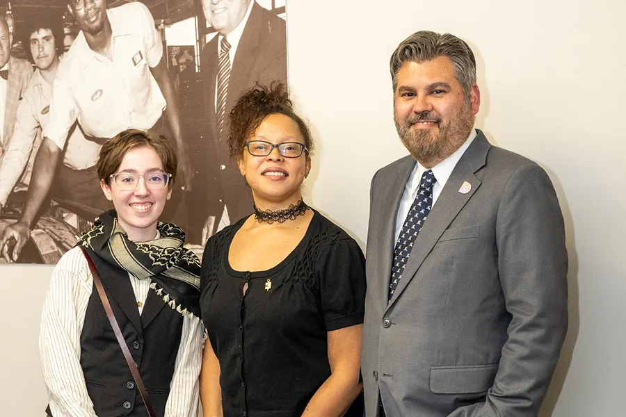 2 Dallas College student honorees standing with Chancellor Lonon