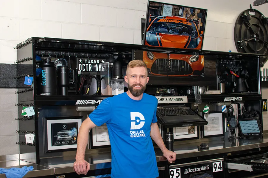 Chris Manning in front of workstation