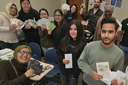 https://pxl-dallascollegeedu.terminalfour.net/fit-in/filters:format(webp)/prod01/dc1-cdn-pxl/media/dallas-college/content-assets/images/news/2024/ESOL-Students-Writing-Cards-thumb-450X300.jpg