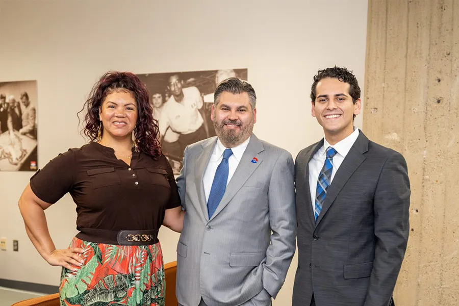 Two ETK Scholarship winners with Dr. Justin Lonon.