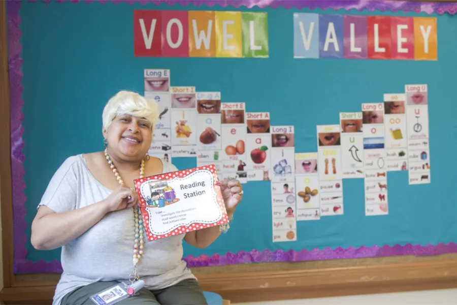 Raven Furlough showing her “Vowel Valley” in her kindergarten classroom at J.N. Ervin Elementary School