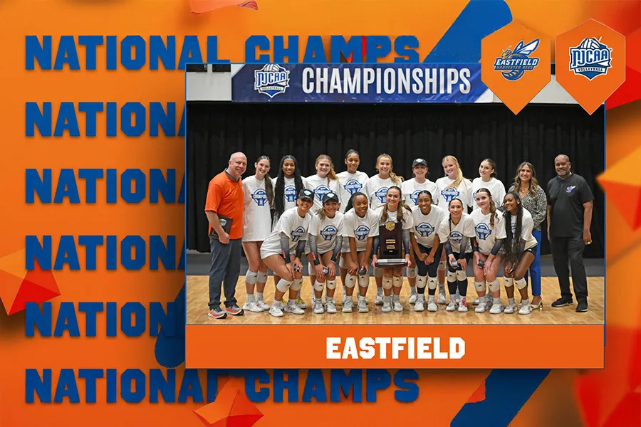 Eastfield volleyball team poses with national trophy.