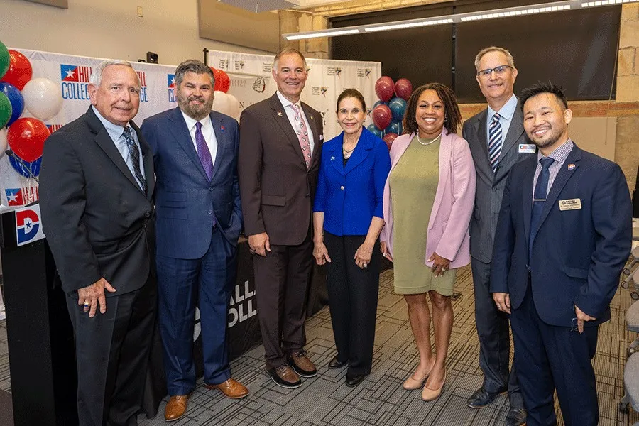 Leaders of the participating community colleges celebrate at a signing ceremony for the PATH Project.