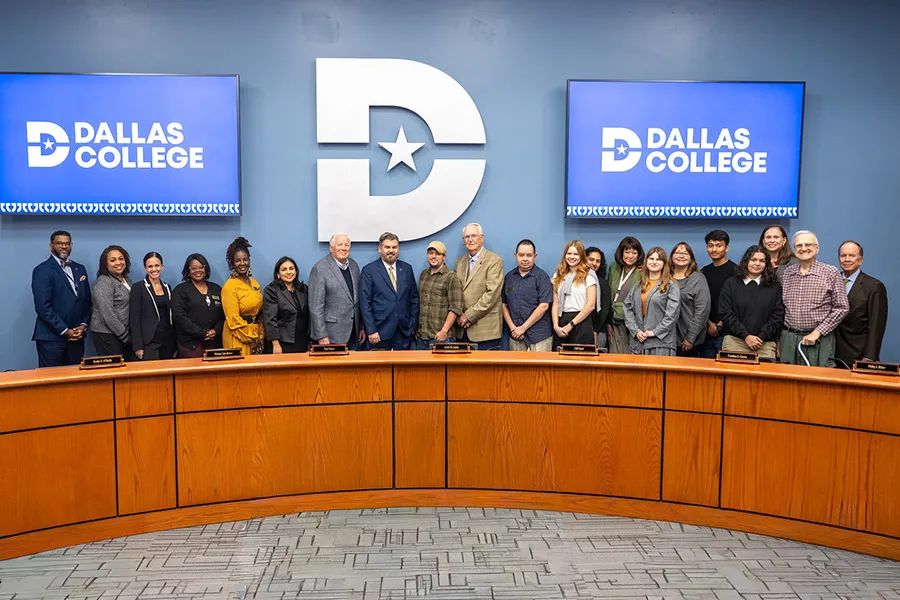 Journalism students are photographed with Dallas College Board of Trustees at the board meeting.