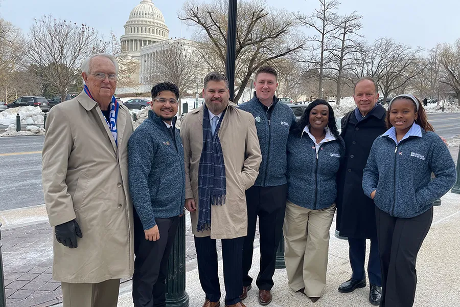 Dallas College students and leaders stand in front of the U.S. Capitol