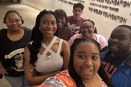 Group of seven students in selfie.