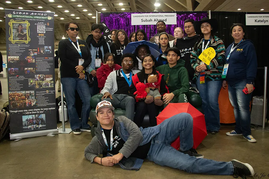 Group of PTK students posed in front of booth at Catalyst.