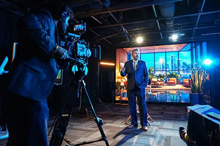 Dr. Lonon on-camera at virtual production soundstage launch.