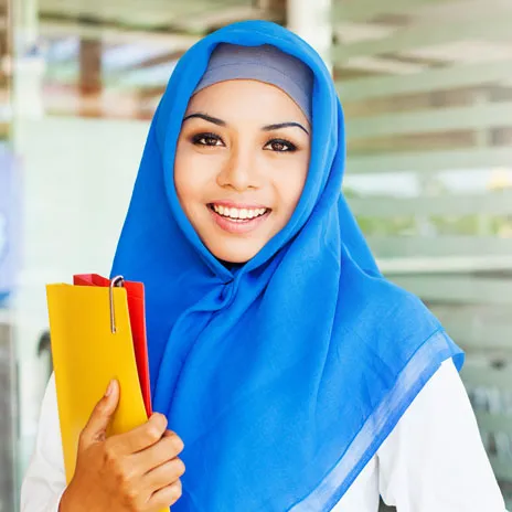 dallas college student smiling with binders in hand
