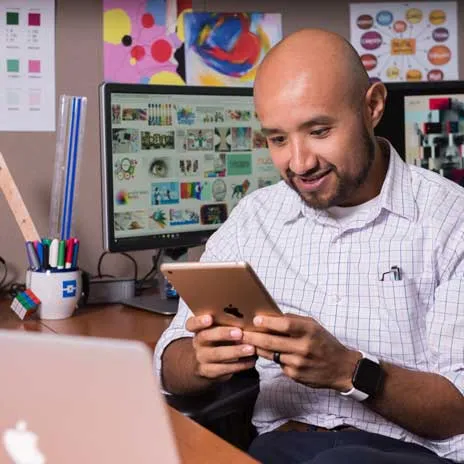 office worker reviewing information on their ipad