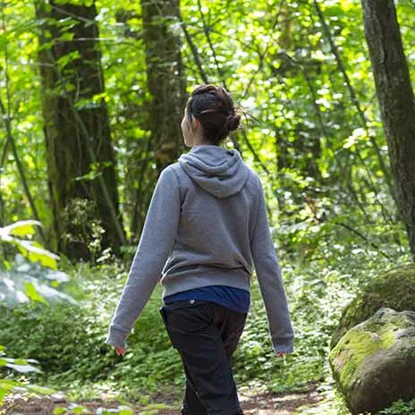 Woman walking in the forest