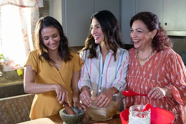Hispanic family cooking a meal together