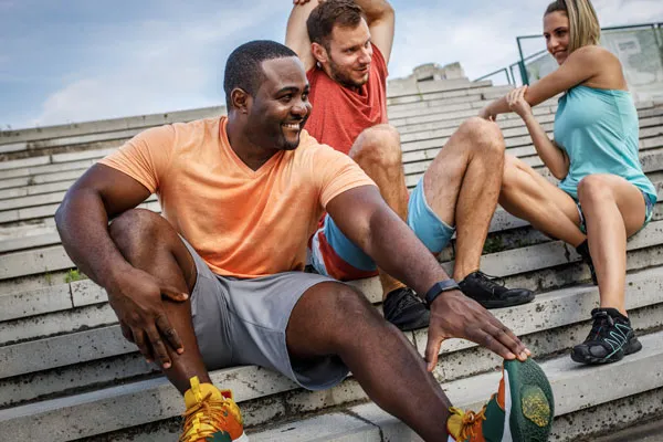 Group of athletic students stretching