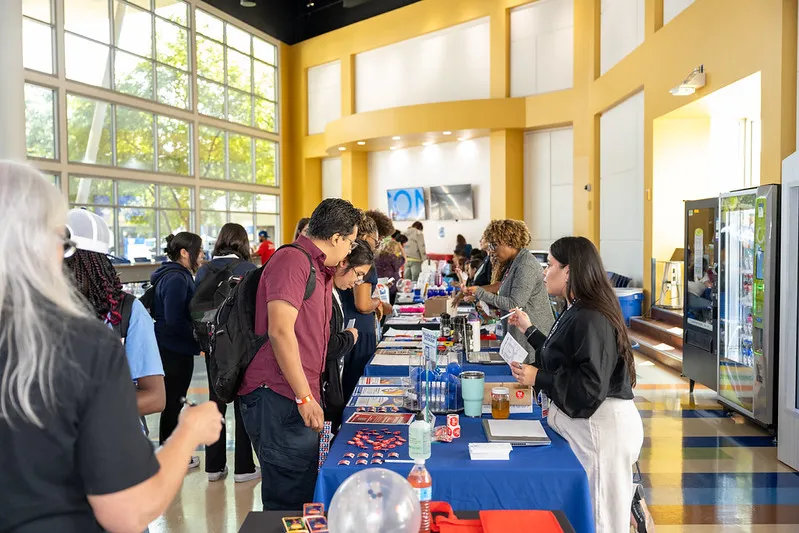 students at resource table at a wellness fair