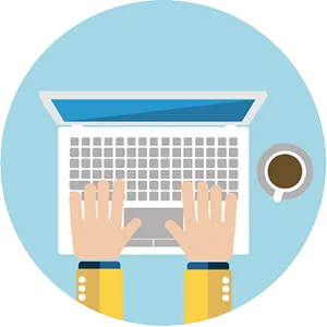 Top-down view of a person typing on a laptop with a cup of coffee to the right.