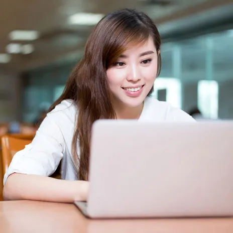 Student using a laptop at the library.