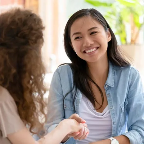 Two women meeting for the first time